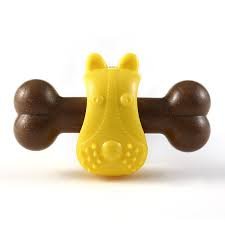 Bone toy for pets made of wood in yellow and brown