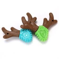 Bone toy for pets made of wood in green and brown